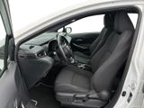 the interior of a car with the door open and the driver ' s seat down
