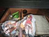two bags of toys in a wooden box on a table