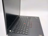 a laptop with a black keyboard on a white surface