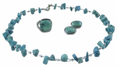 a close up of a necklace and earrings with turquoise stones