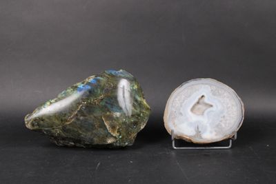 two pieces of green and white agite on a black surface