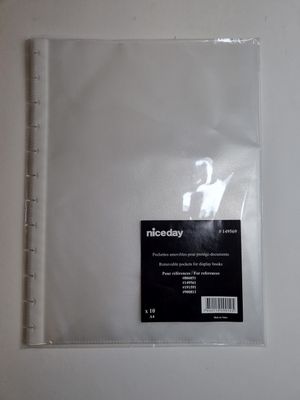 the back side of a clear plastic binder with a sticker on it
