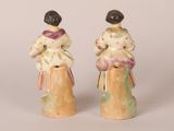 pair of ceramic figurines of a woman and a child
