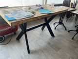 a table that has a bunch of papers on it