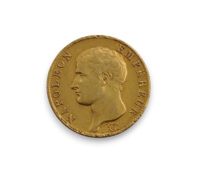a gold sovereign coin with a profile of a man