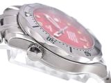 a close up of a wrist watch with a red dial