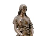 bronze statue of a woman with a bucket of water on a pedestal