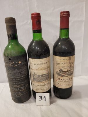 three bottles of wine are lined up on a table