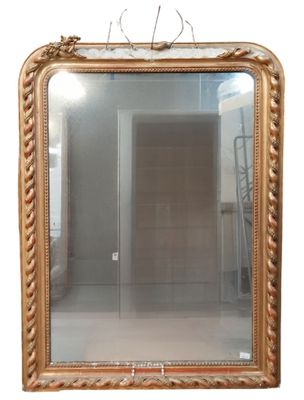 a mirror hanging on the wall in a room