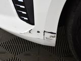 a close up of the front of a white car