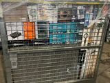 a cage with a bunch of items inside of it