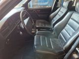 a picture of a car with black leather seats and a steering wheel