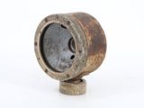 an old rusted metal object on a white surface