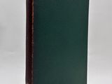 a green book with a brown binding on the cover