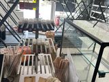 a display case in the middle of a store filled with items