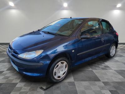 a picture of a blue car parked in a garage