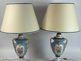 two lamps that are sitting on a white table