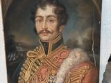 portrait d'un homme en uniforme militaire, avec une moustache et une barbichette
