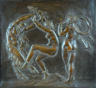 an image of a bronze plaque depicting three nudes in a circle