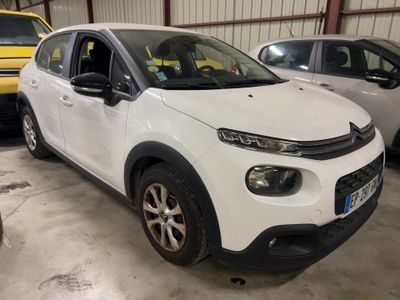 the white citrole is parked in a garage next to other cars