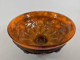 a brown bowl that is sitting on a table