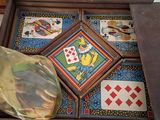 a wooden tray with cards and a bag of chips on it