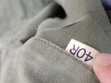 a person holding a piece of clothing with the number forty on it