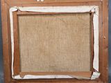 an old picture frame with a piece of burlock paper taped around it