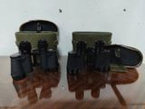 a lot of binoculars that are sitting on a table