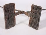 pair of antique iron door handles with intricate designs on them