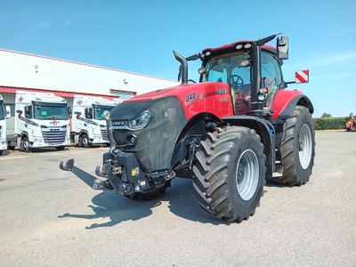 a picture of a red tractor parked in a parking lot