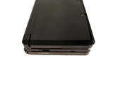 a black laptop computer sitting on top of a white surface