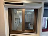 a small window in the corner of a room