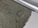 a close up of a metal object on a table