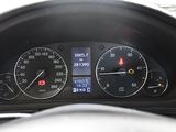 a close up of a car dashboard with a speedometer