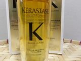 the bottle of kerastase is sitting on a table next to a box of kerastase