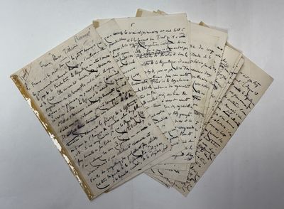 a pile of old letters sitting on top of a white table