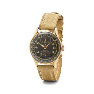 une photo d'une montre en or avec un cadran noir et un bracelet en cuir marron