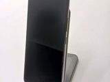 a cell phone that is sitting on top of a stand