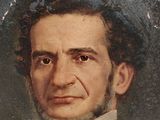 portrait of a man in a black suit and bow tie