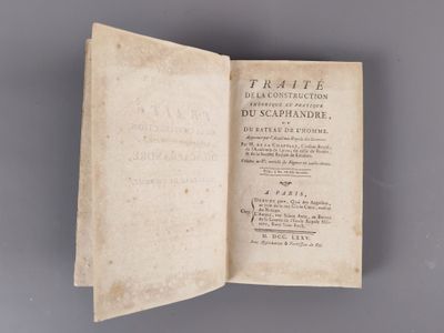 an open book with writing on it sitting on top of a table