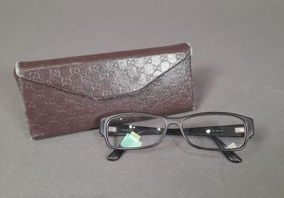 a pair of glasses and a case on a table