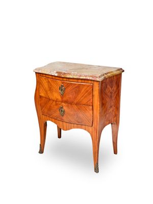 an image of a small wooden chest of drawers with marble top