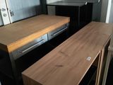 a desk with a drawer and a chair in a room