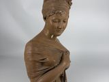 an image of a statue of a woman holding a bird in her hand