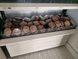 a display case filled with chocolates in a store