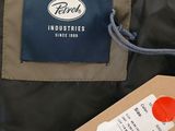 a label on the back of a jacket with a tag attached to it