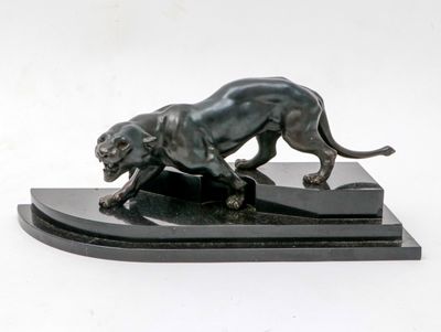 statue of a lion on a marble base on a white background