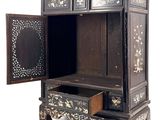 a wooden cabinet with a drawer and a mirror in it