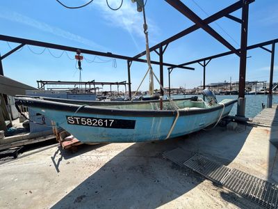 a boat that is sitting on the dock by the water